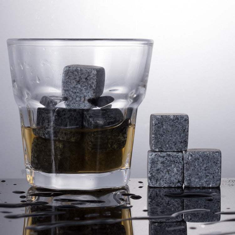 A wooden box for whiskey marble ice cubes